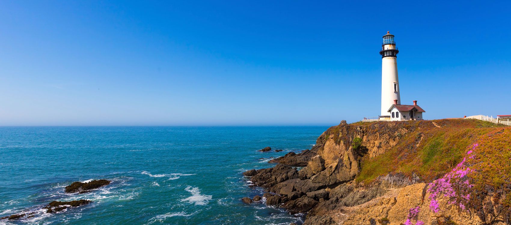 Lighthouse on rocky coastline