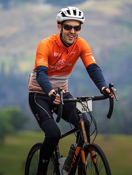 Man in cycling gear riding on biclycle 