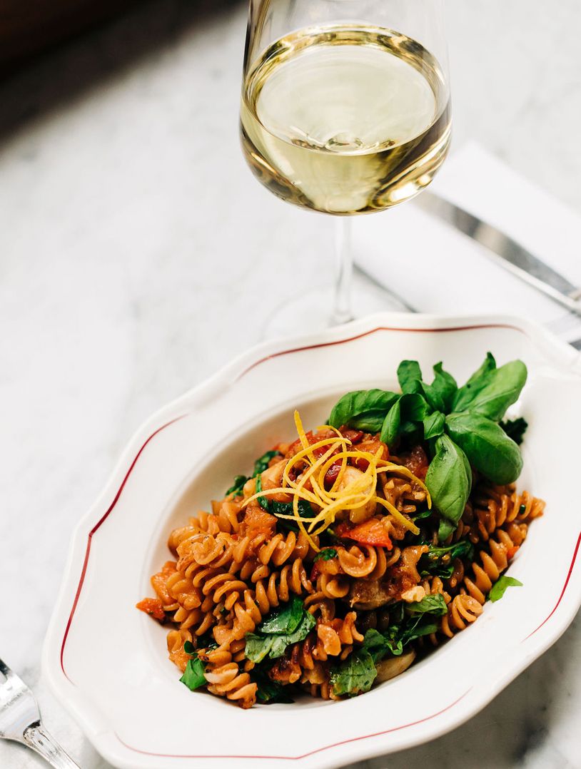 spiral pasta garnished with fresh basil