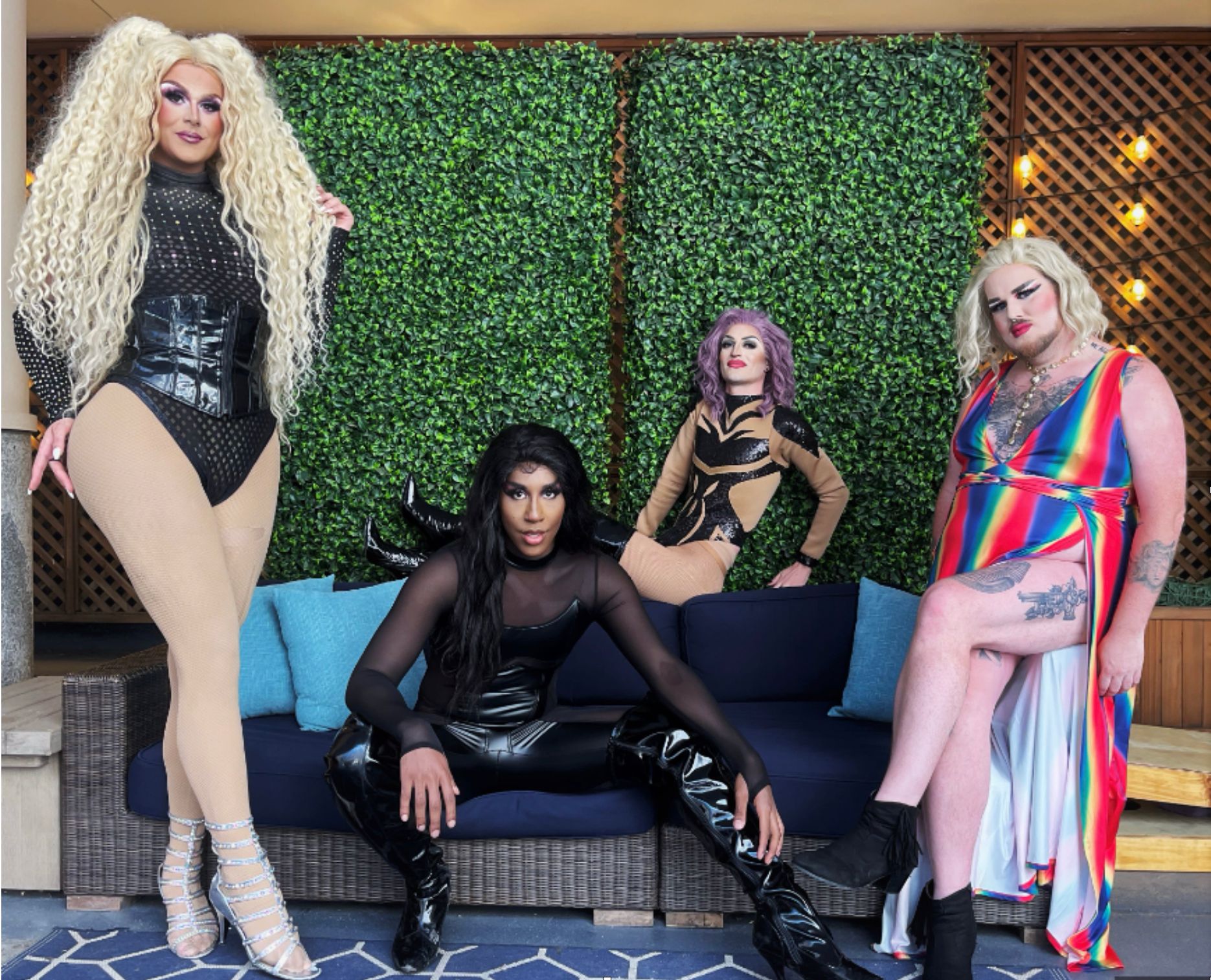 four drag queens posing for a brunch out event