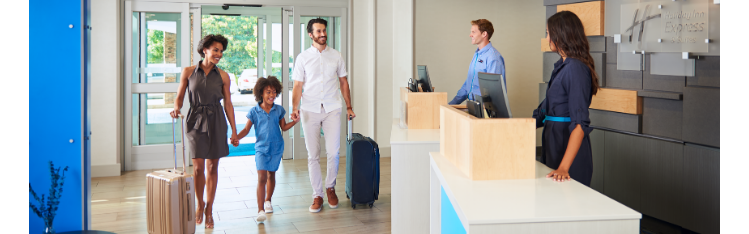 Family entering hotel lobby