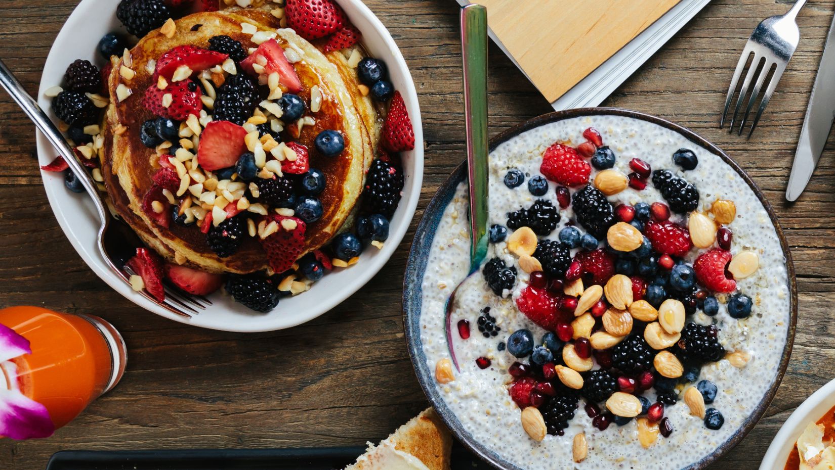 plates of pancakes and hot cereal with fruit