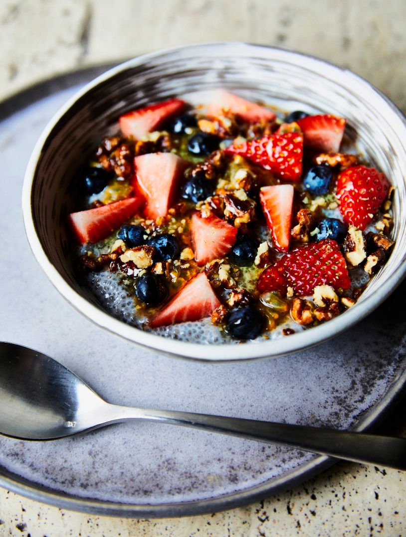 colorful cut berries in bowl of granola