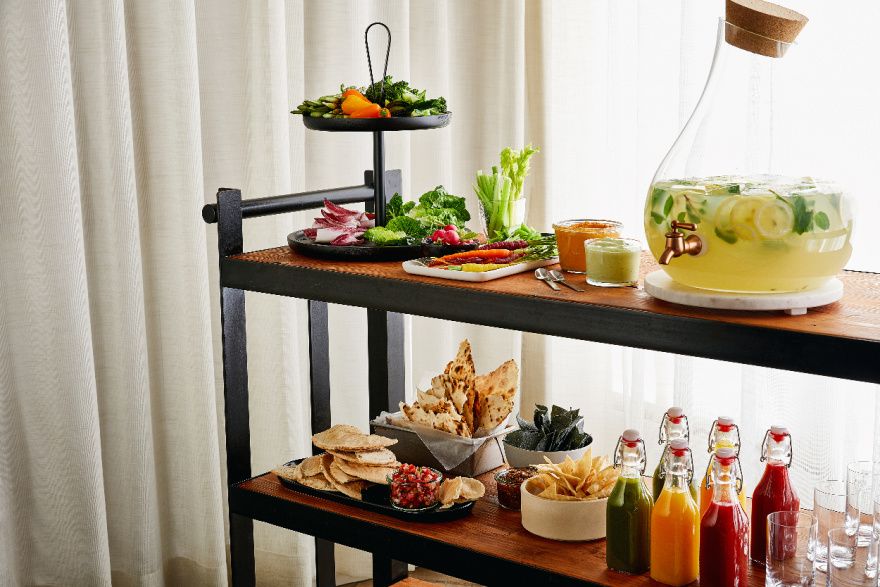 skinny buffet side table with healthy food and drink