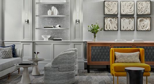 Light gray and white room with bright yellow chair