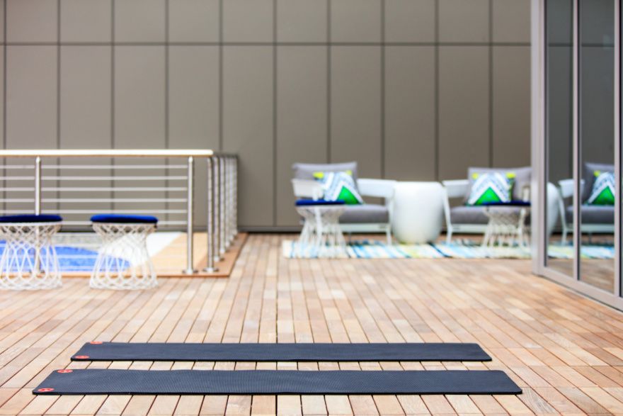 Yoga mats on a wood paneled floor